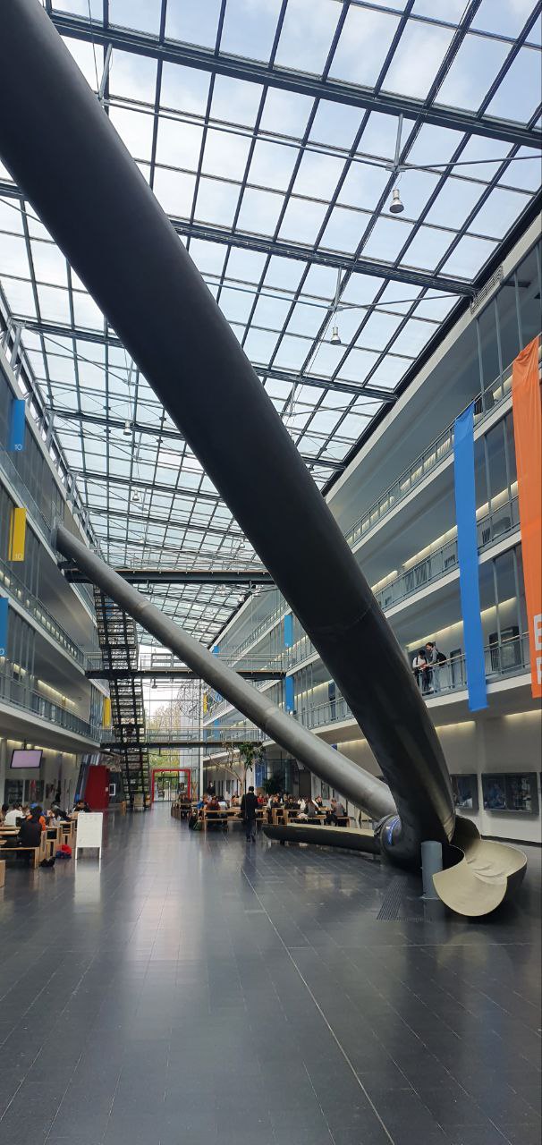 image of the three-stories tall parabolic slide in the maths/compsci building.